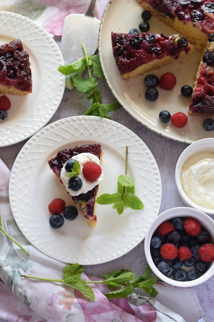 Berry cake on serving plates.