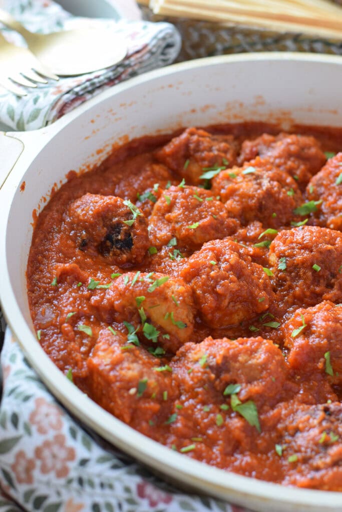 Close up of chicken parmesan meatballs.
