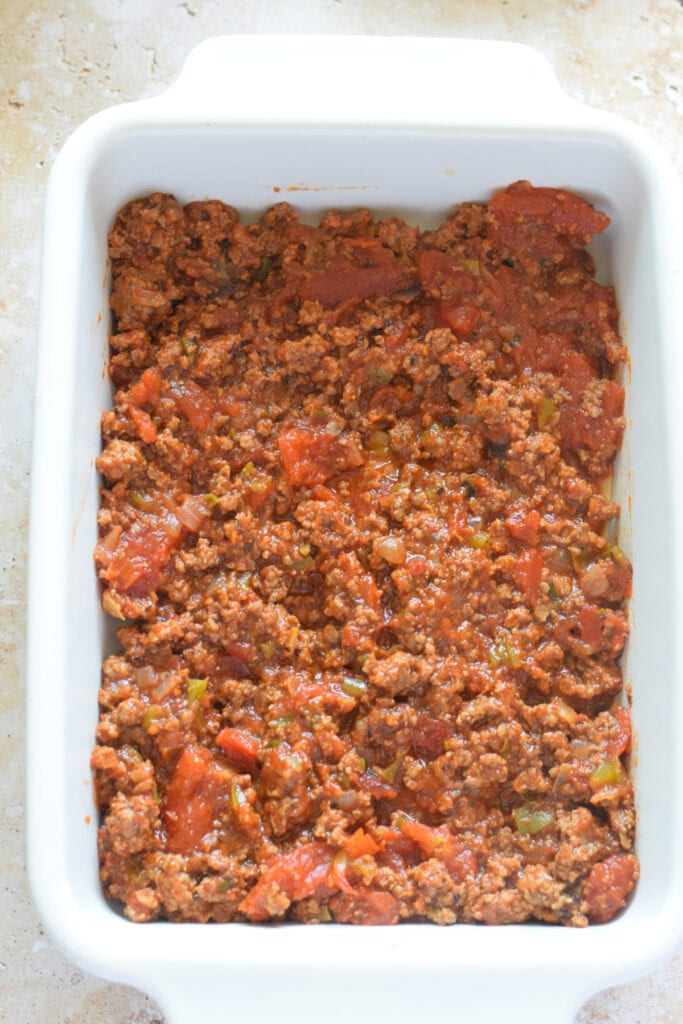 Ground beef layer in a casserole.