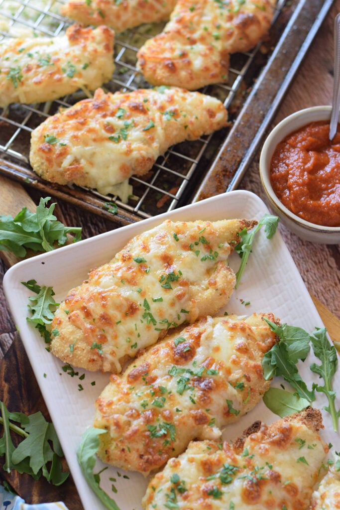 Close up of mozzarella crusted chicken.