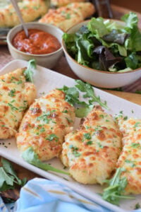 Close up of baked mozzarella chicken.
