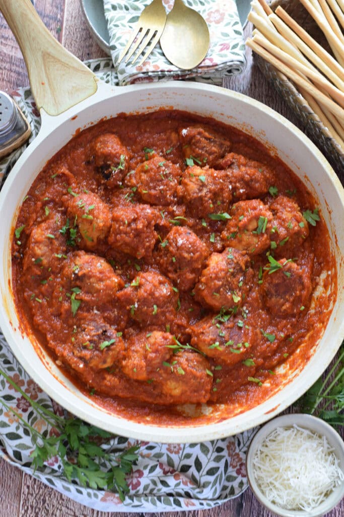 Meatballs in a skillet.