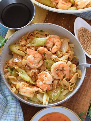 Close up of a shrimp and noodle stir fry.