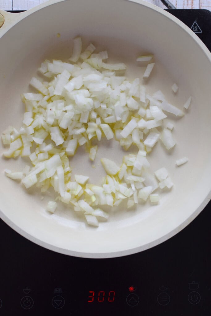 Cooking onions in a skillet.