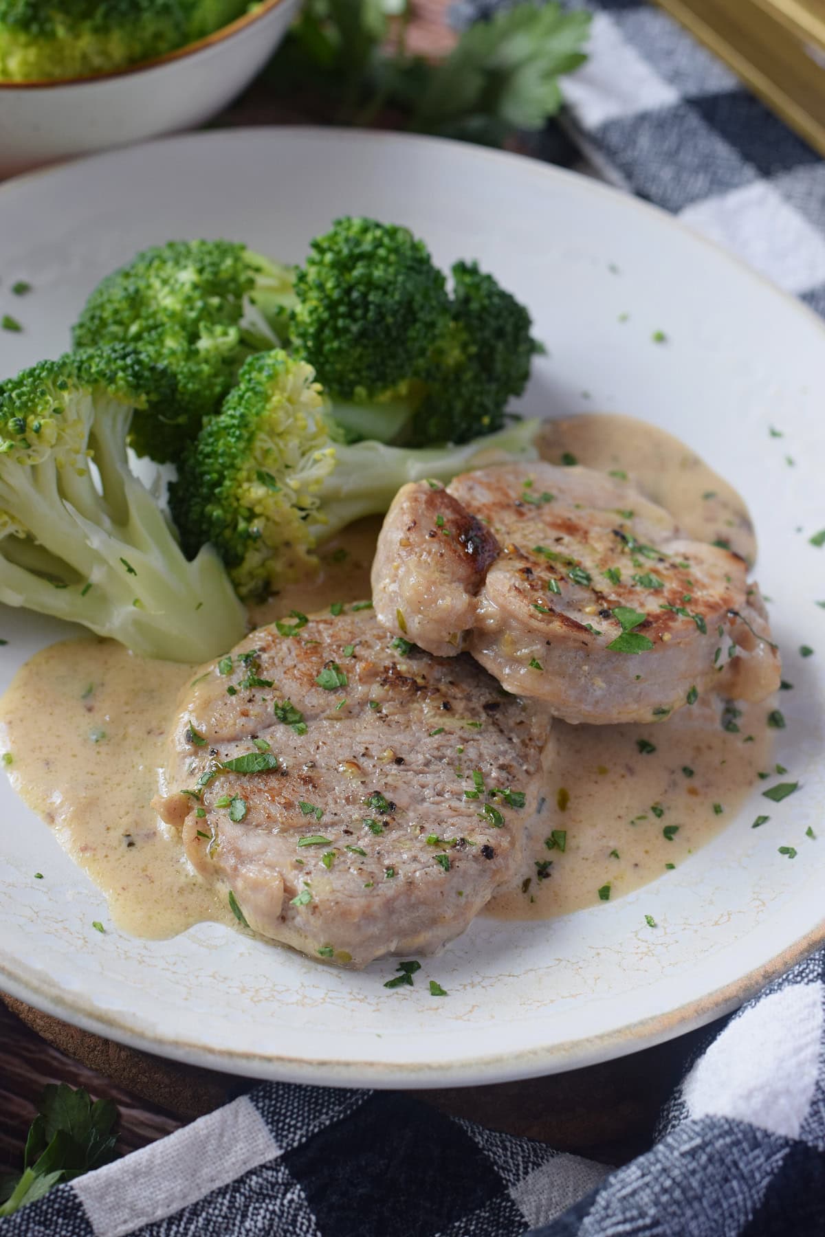 Pork on a plate with a sauce.