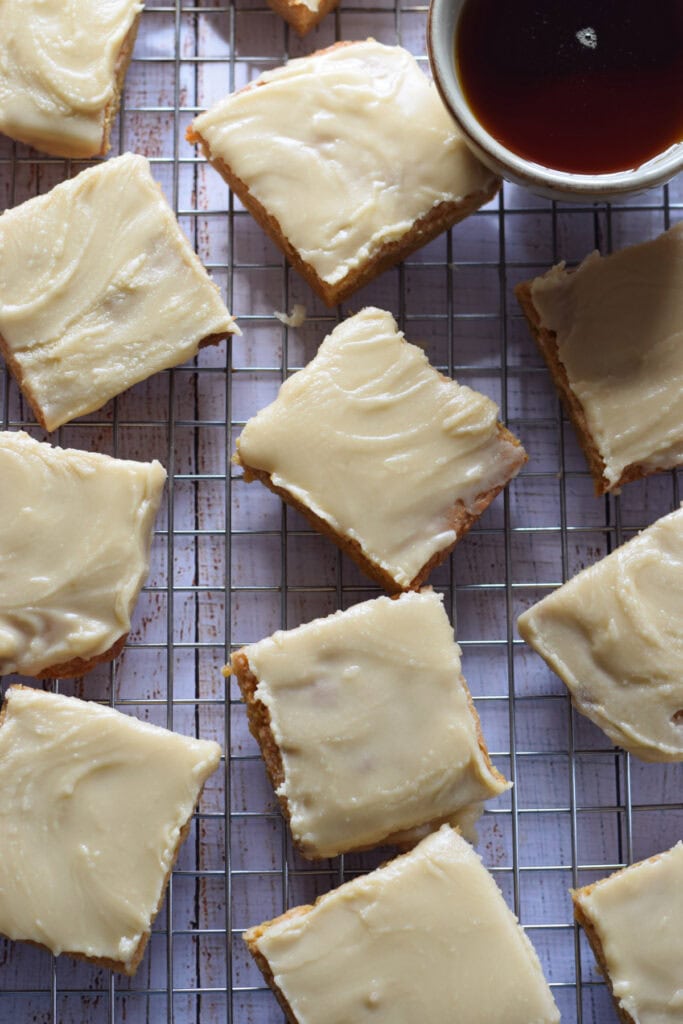 Maple glazed blondies on a tray.