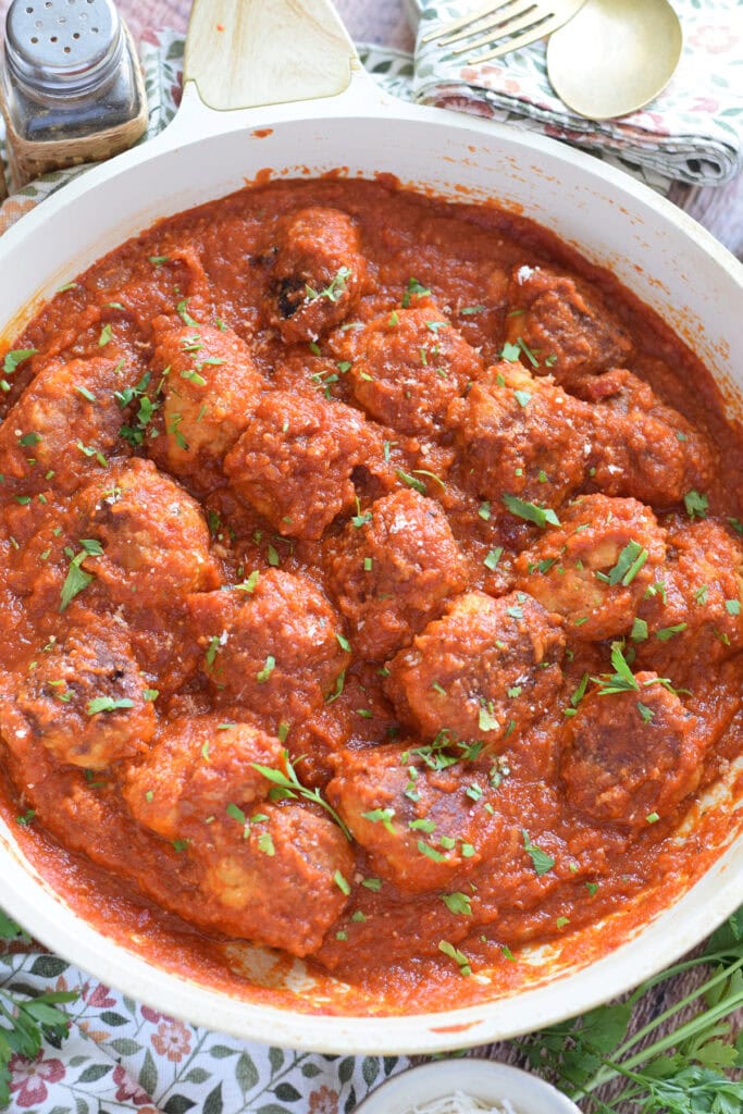 Chicken parmesan meatballs in marinara sauce.