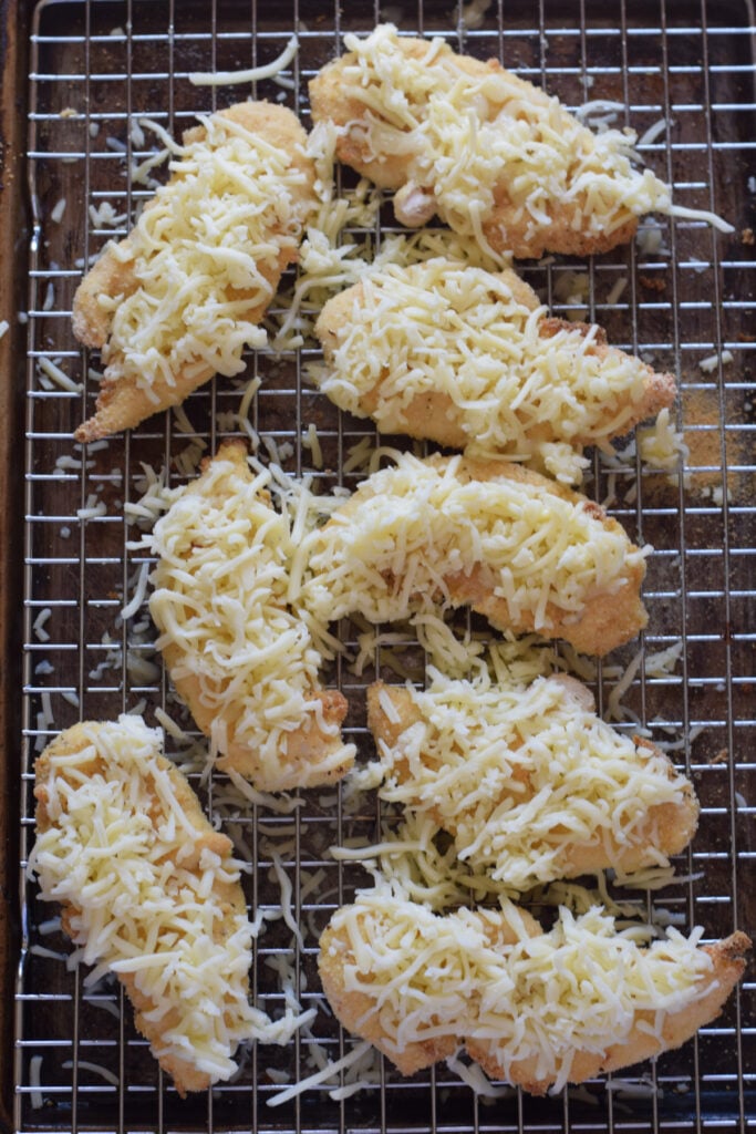 Chicken topped with mozzarella cheese.