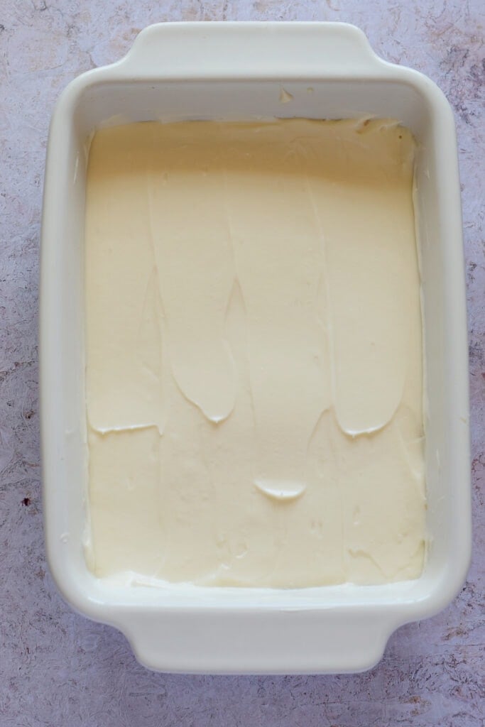 Cheesecake filling in a ceramic dish.