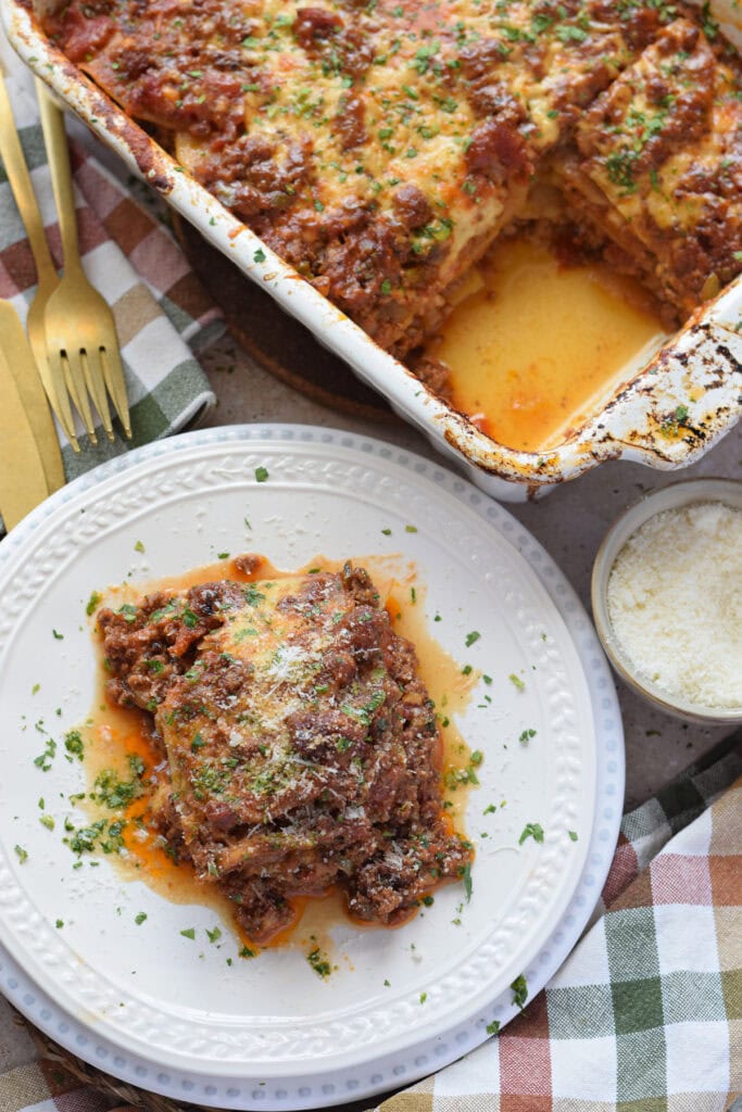 Ground beef casserole with potatoes in a white casserole dish.