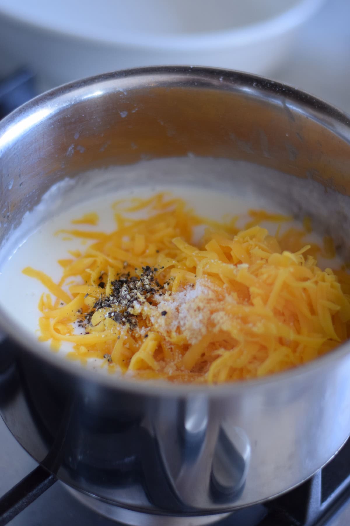 Making a cheese sauce for pasta.