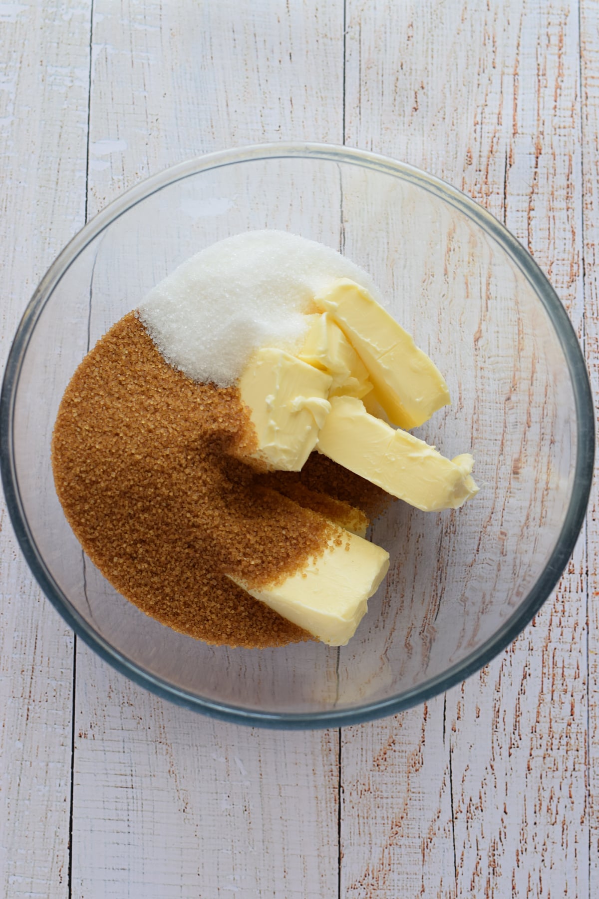 Butter and sugar in a bowl.