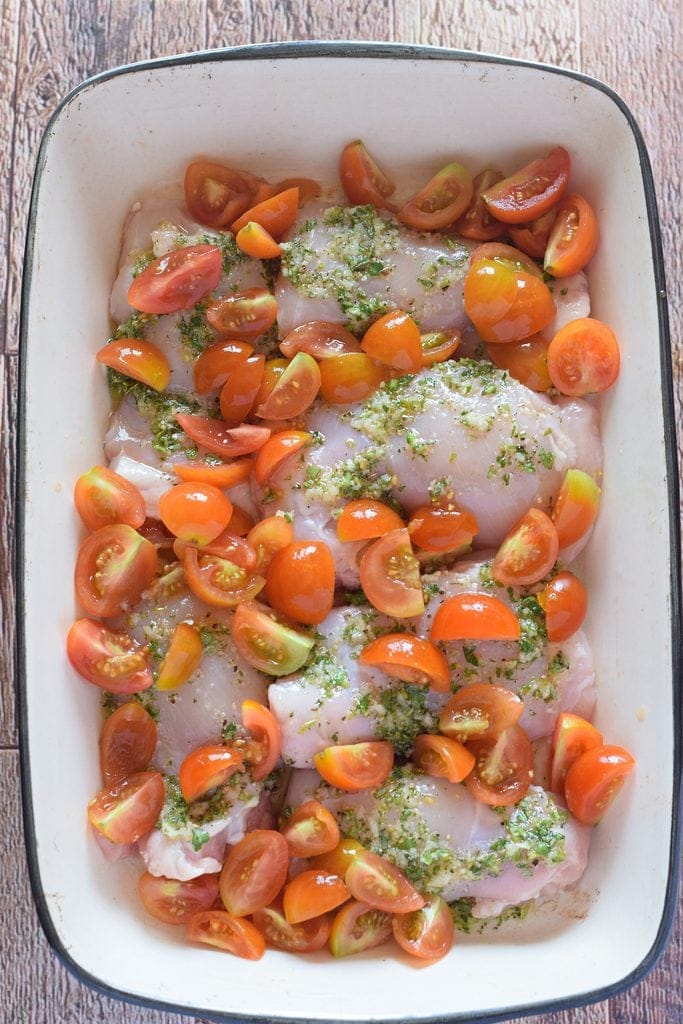 Ready to bake chicken with tomatoes.