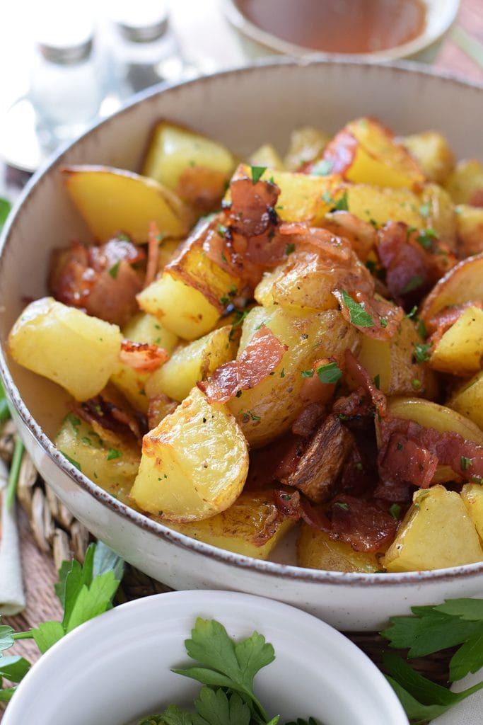 Close up of potatoes roasted with bacon and honey.