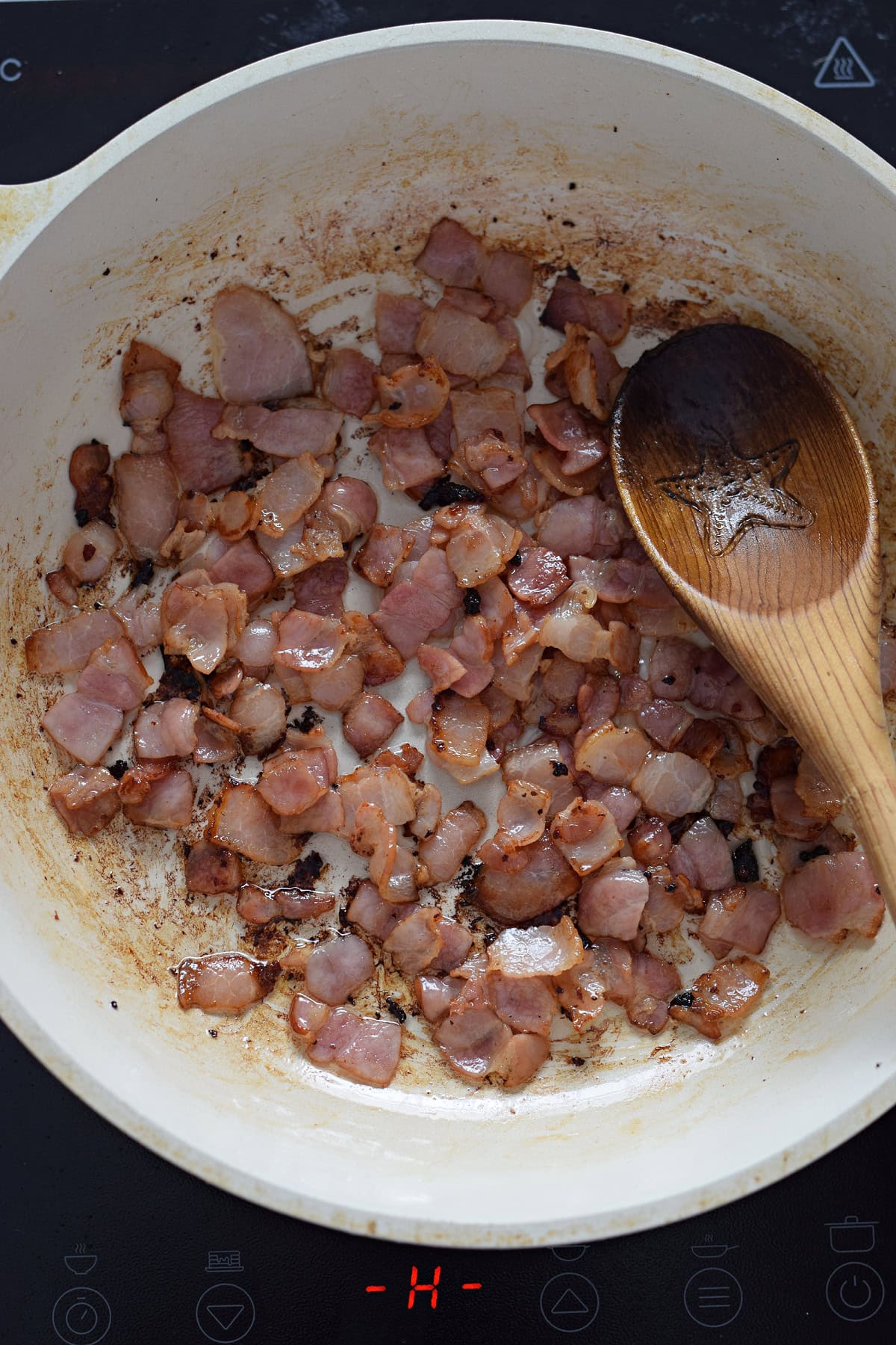 Cooking bacon in a skillet.