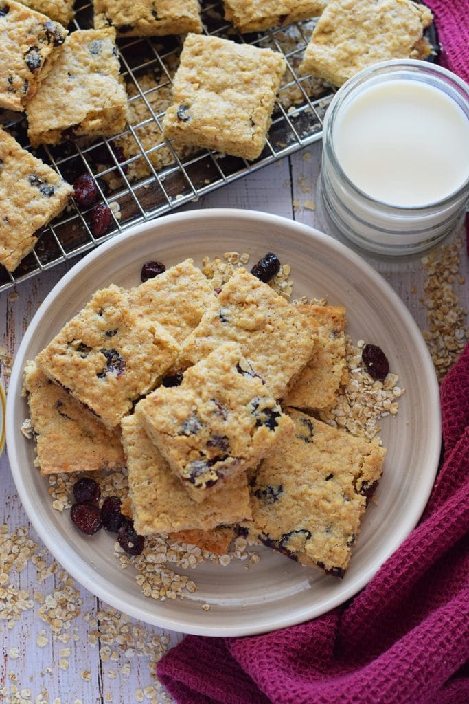 Cranberry oatmeal cookie bars on a plate.