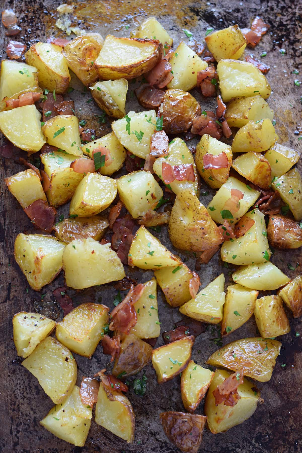 Bacon roasted potatoes on a baking sheet.
