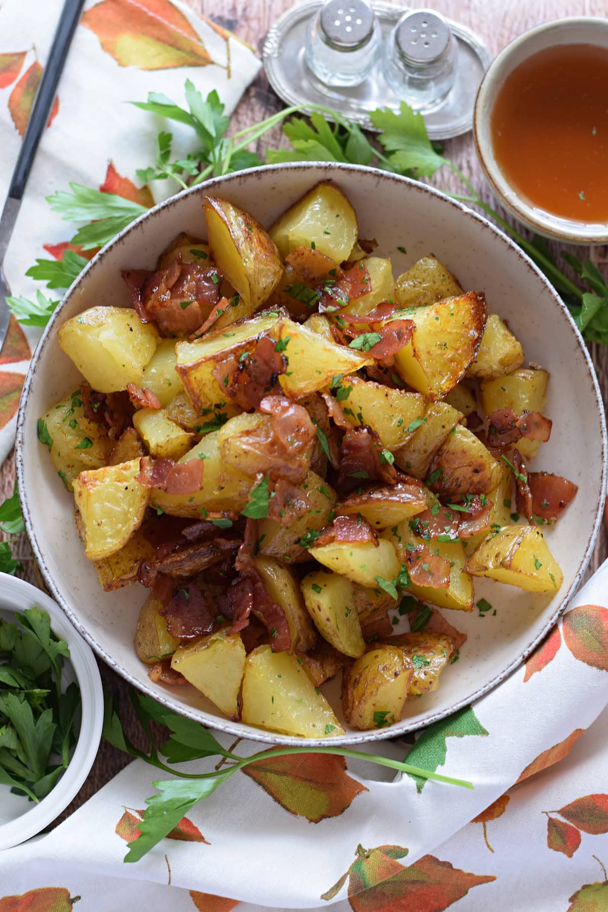 Potatoes in a dish with bacon and honey.