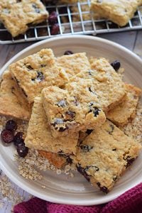 Cranberry oatmeal cookie bars on a plate.