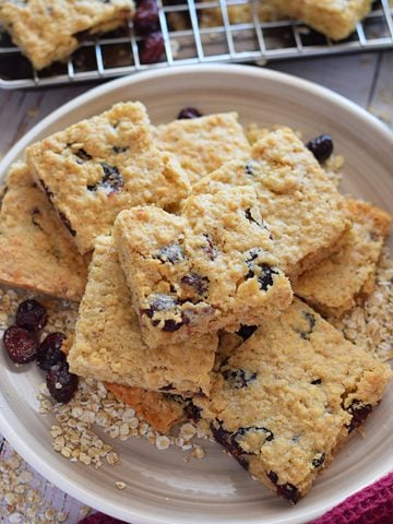 Cranberry oatmeal cookie bars on a plate.