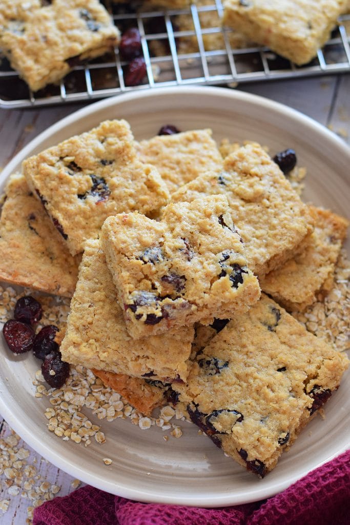 Cranberry oatmeal cookie bars on a plate.