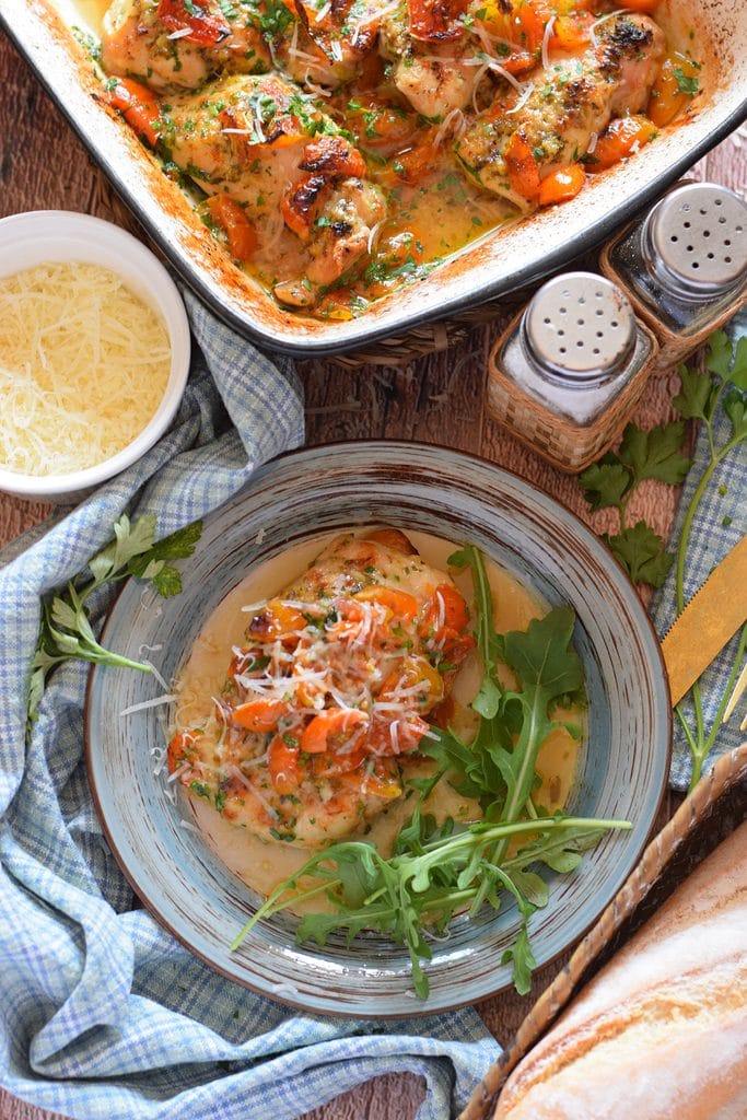Tomato chicken in a serving dish and on a side plate.