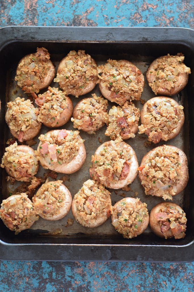 Stuffed mushrooms in a baking tray.