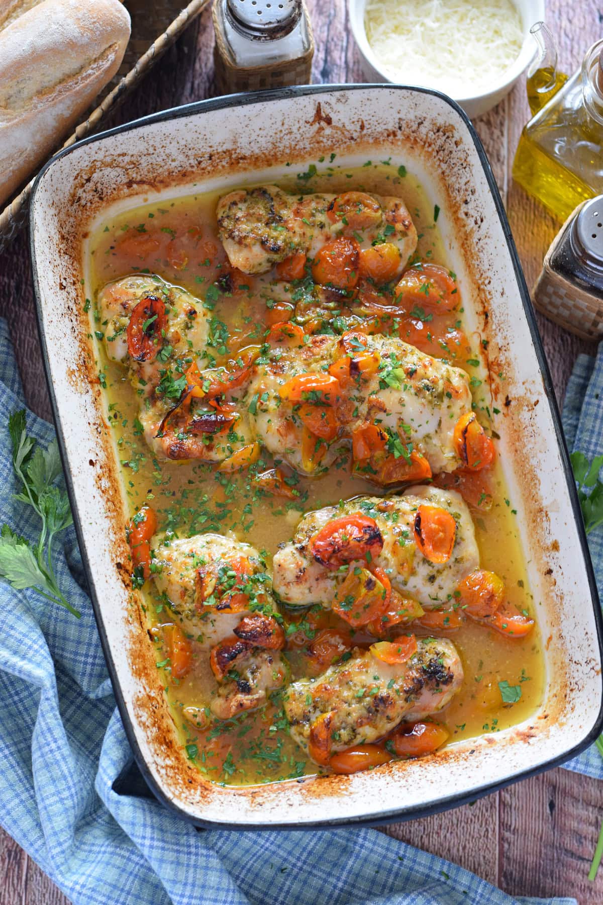 Baked tomato chicken in a casserole dish.
