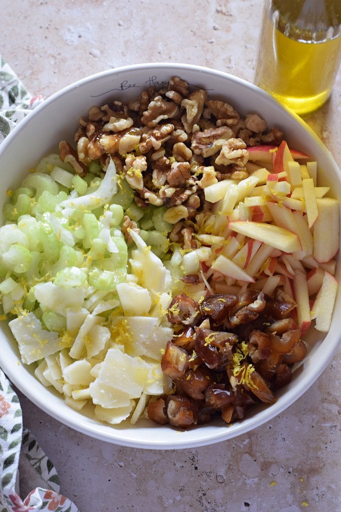Salad ingredients in a white bowl.