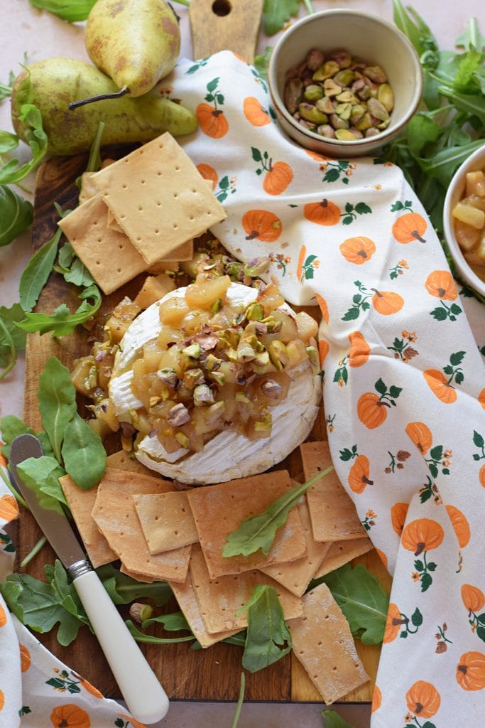 Brie cheese wheel with pears.
