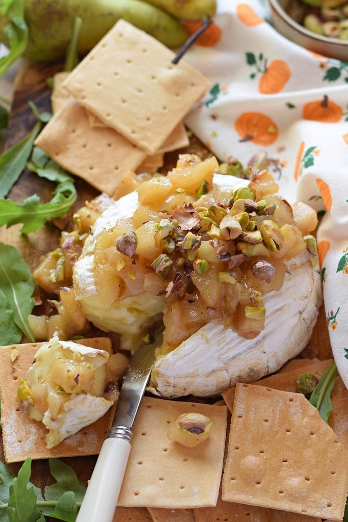 Close up of brie cheese with caramelized pears.