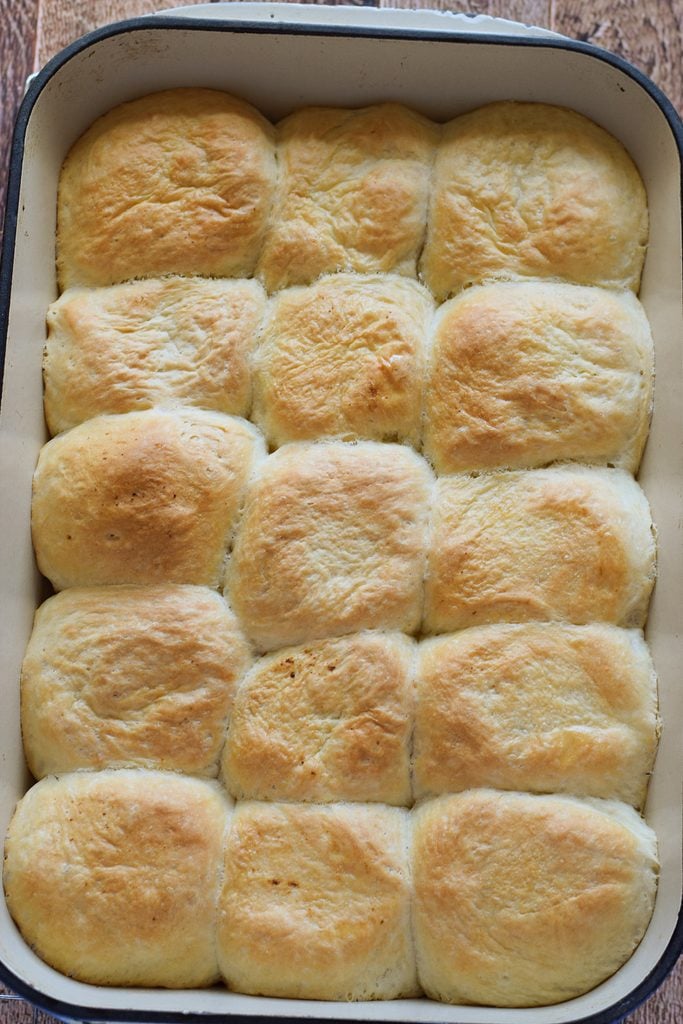 Baked bread rolls in a baking dish.