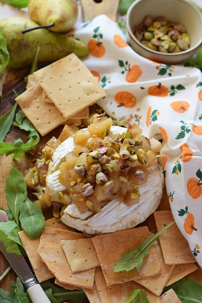 Baked brie with caramelized pears and pistachios.