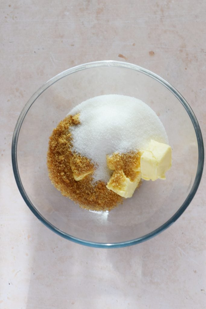 Sugar and butter in a large mixing bowl.