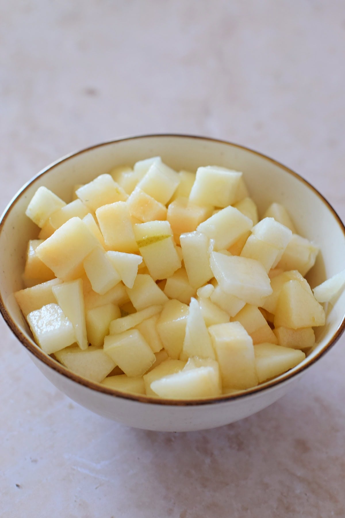Diced pears in a bowl.