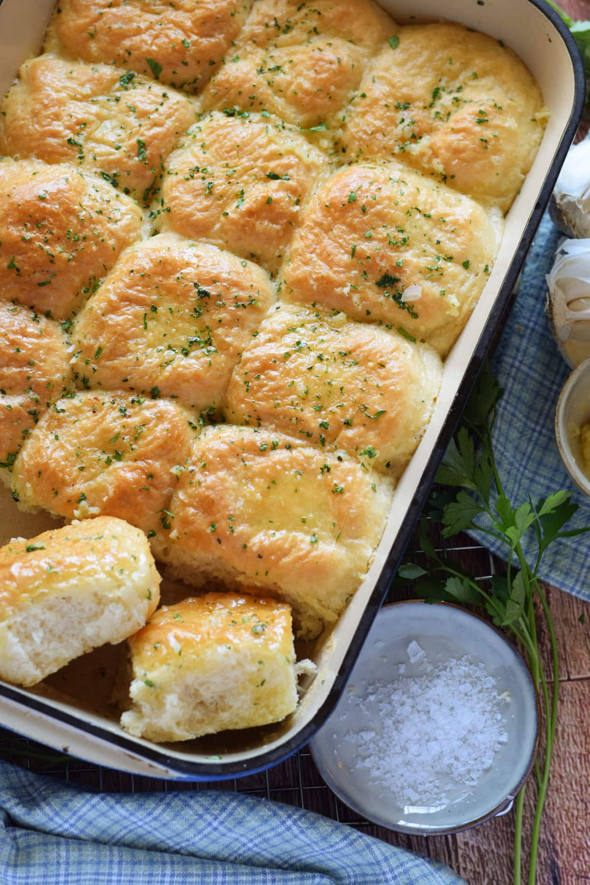 Garlic butter dinner rolls in a baking dish.