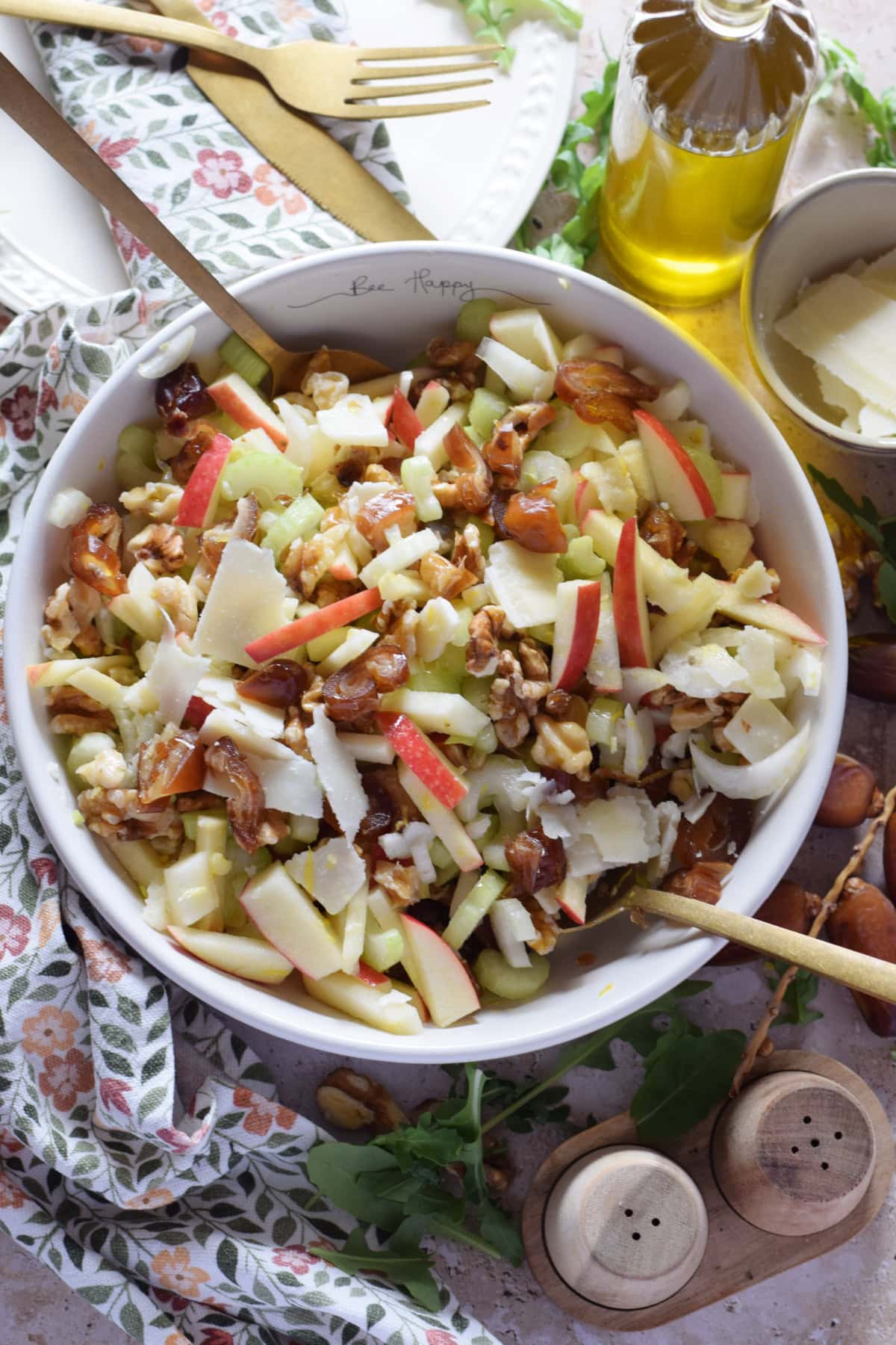 Apple celery salad in a white bowl.