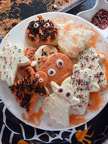 Frosted halloween cookies on a tray.