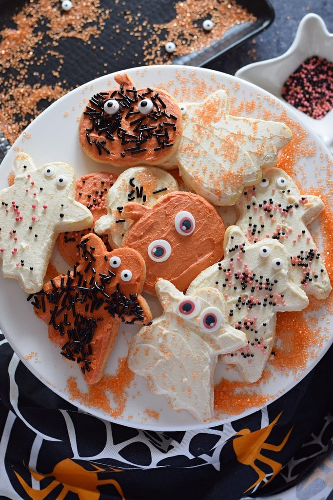 Frosted halloween cookies on a tray.