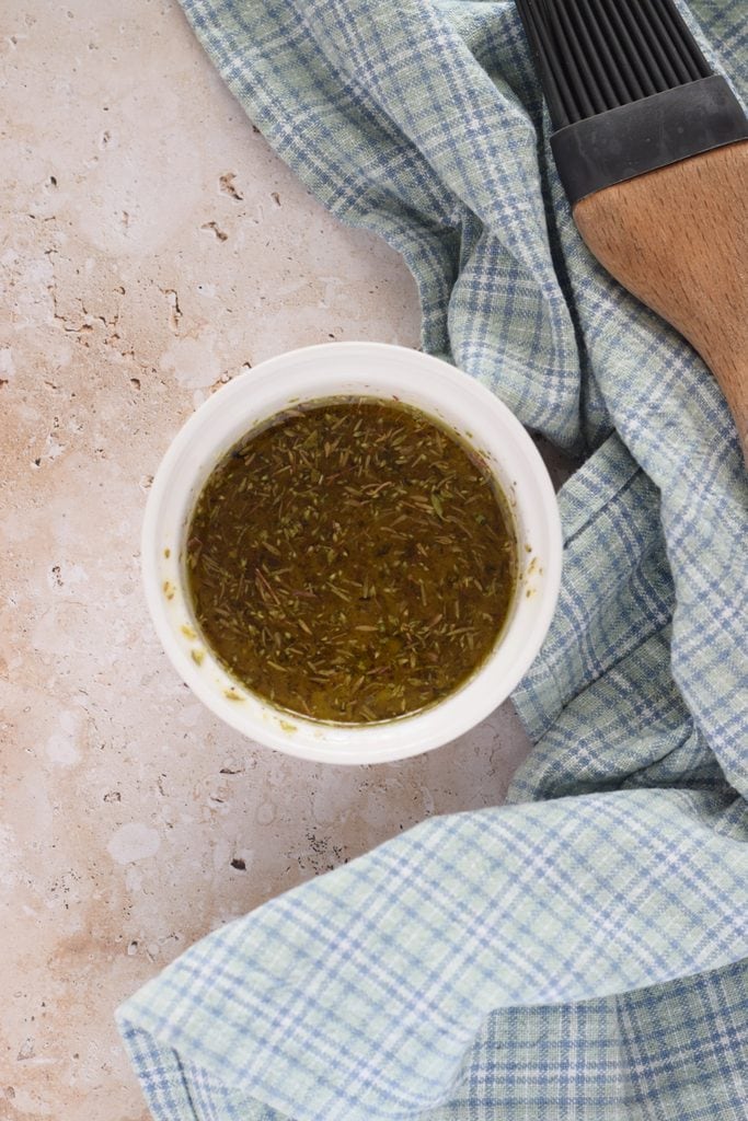 A herb marinade in a small bowl.