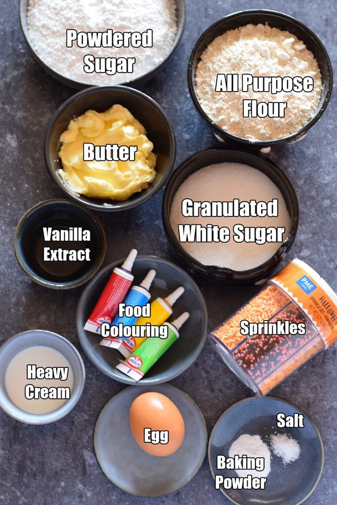 Ingredients to make frosted halloween cookies.