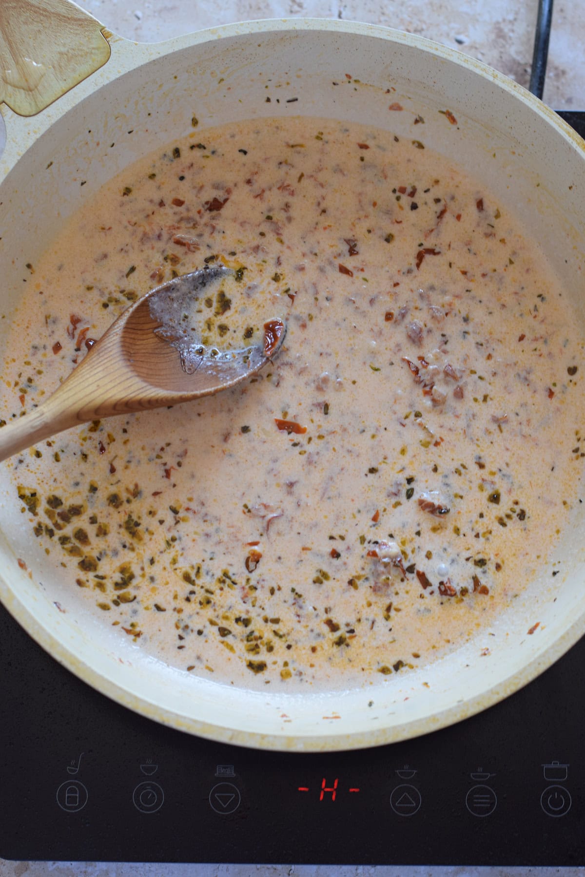 Making a pasta sauce in a skillet.