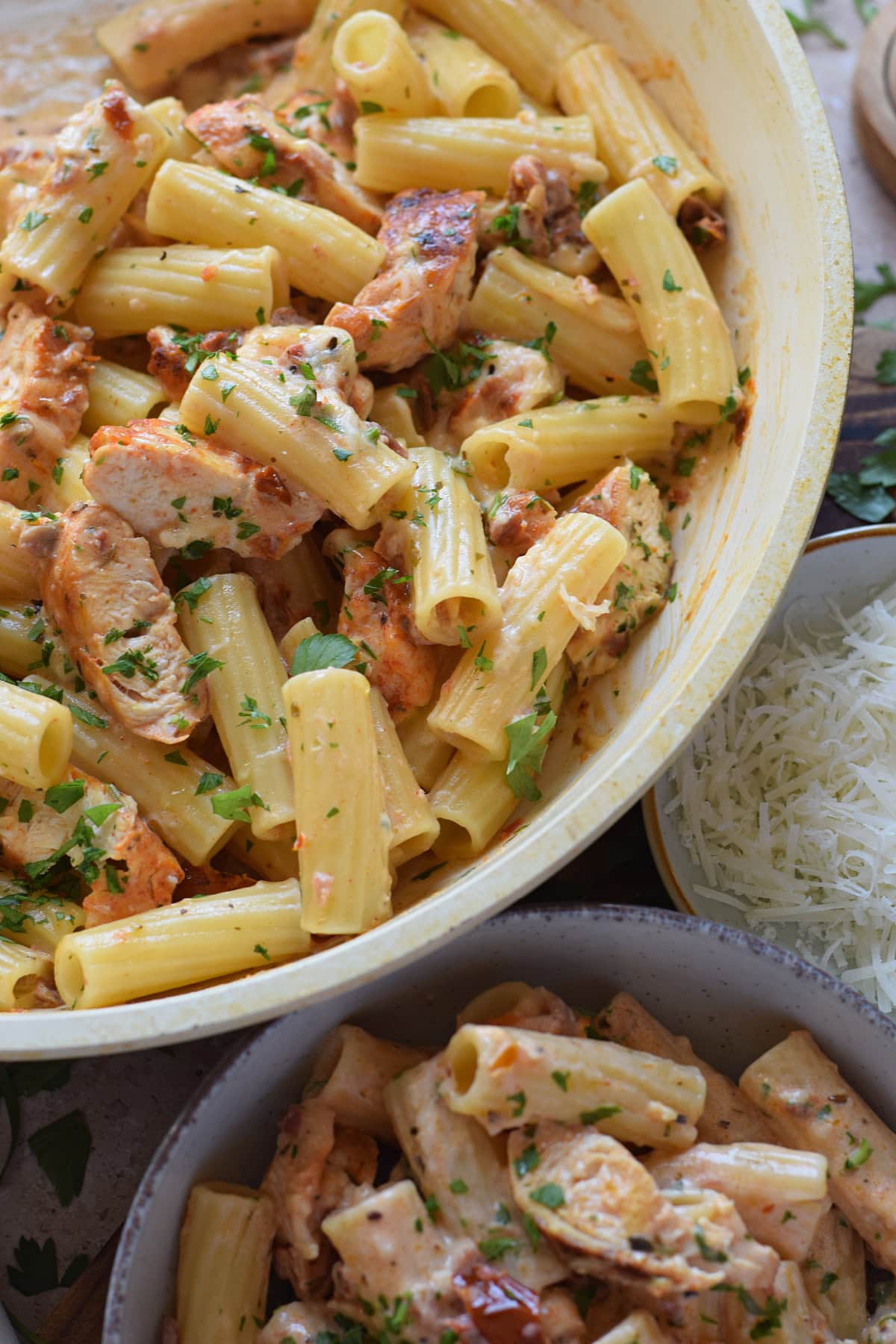 Close up of pasta and chicken in a skillet.