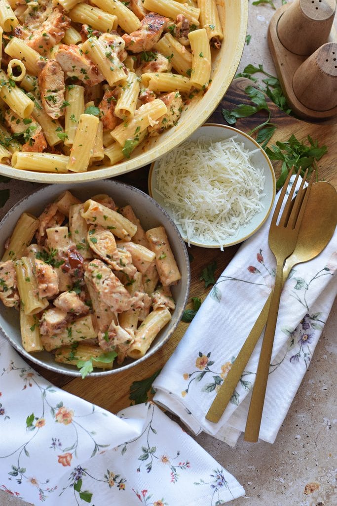 Penn pasta with chicken and parmesan cheese.