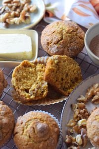 Pumpkin walnut muffins on a plate.