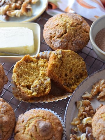 Pumpkin walnut muffins on a plate.
