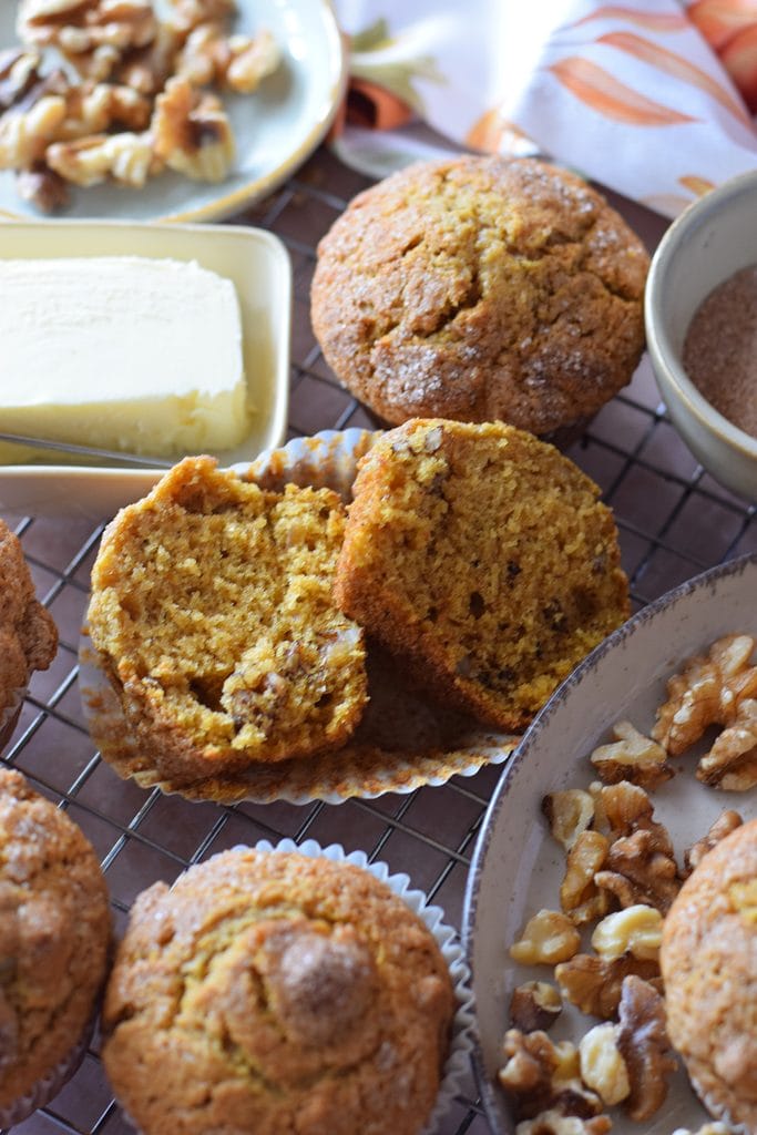 Pumpkin walnut muffins on a plate.
