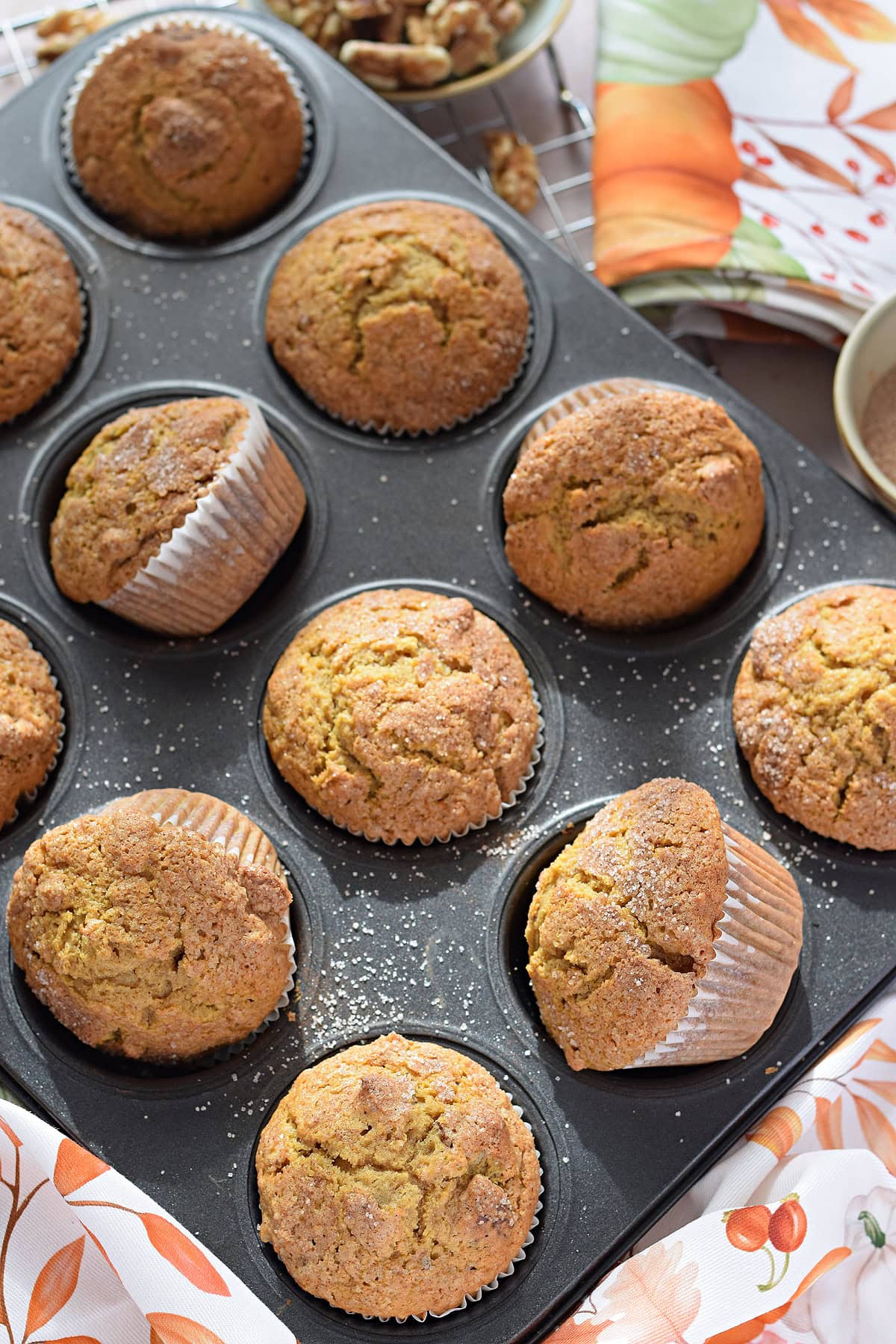 Pumpkin muffins in a baking pan.