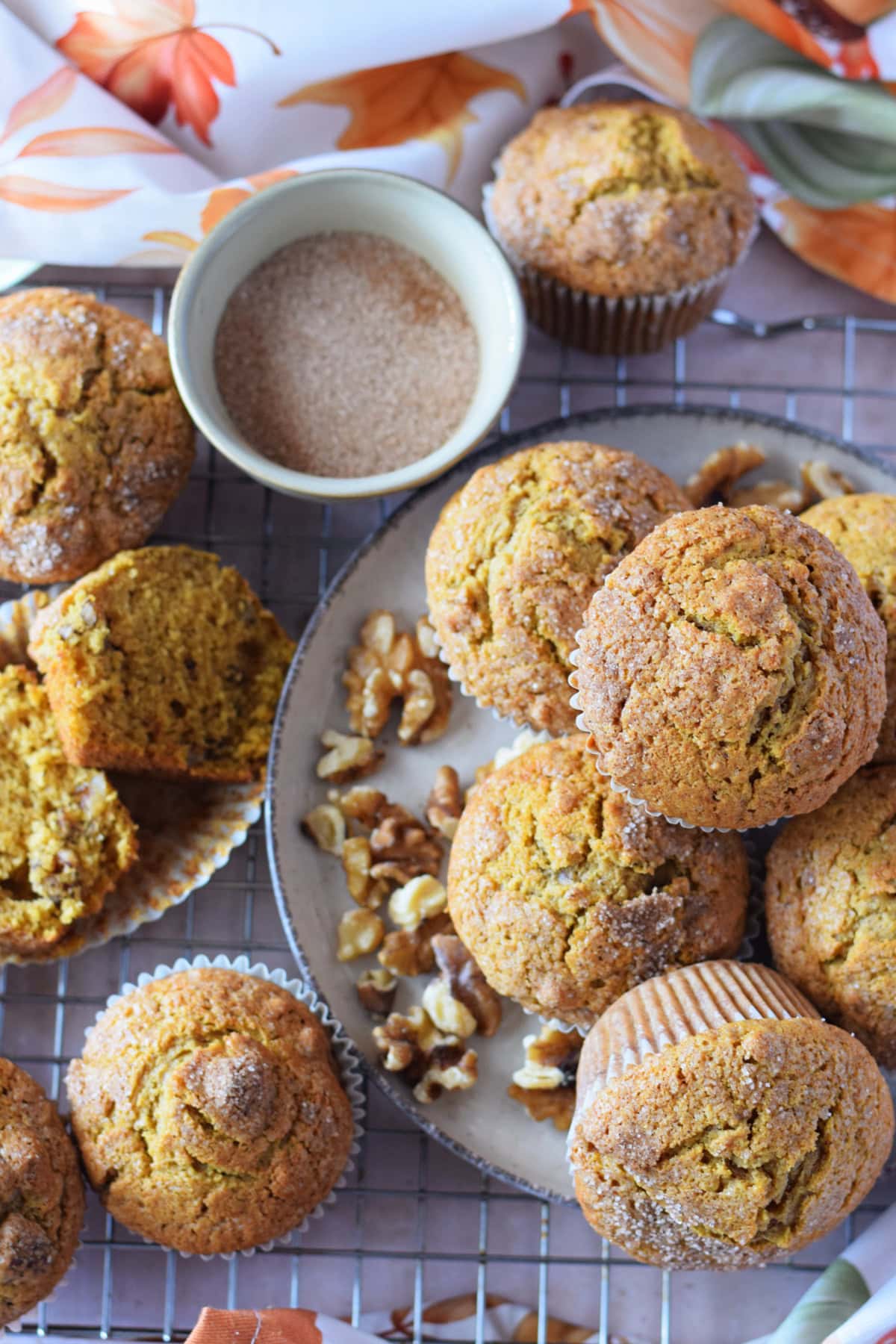 Pumpkin walnut muffins on a baking tray.
