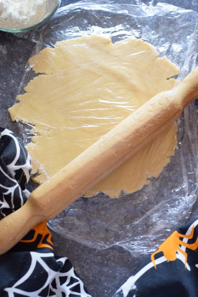 Rolling cookie dough.